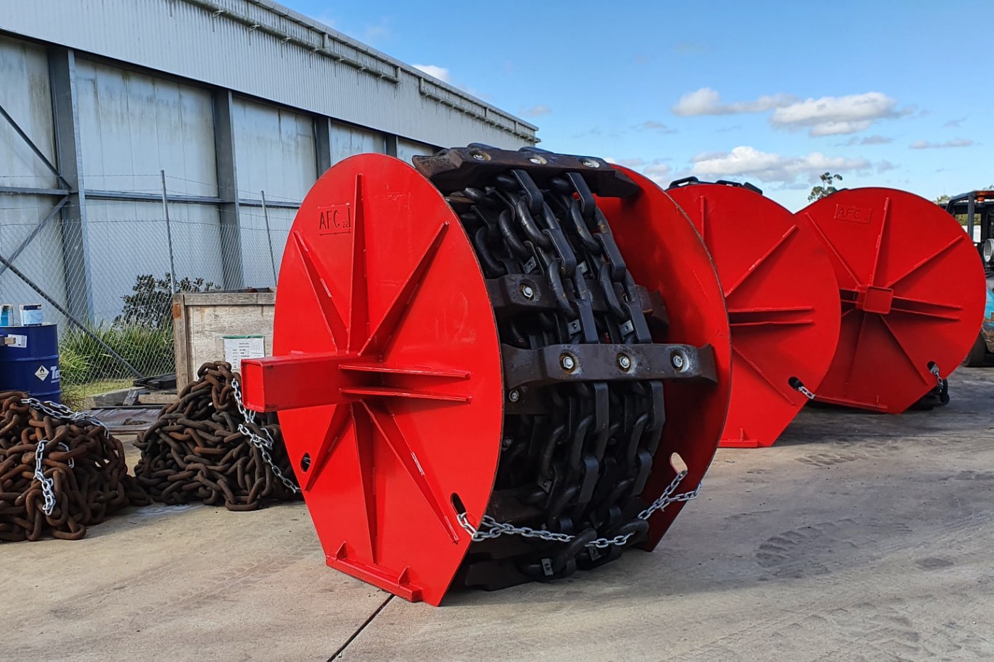 Refurbished AFC chain assembly with red flight bars, complete and ready for service